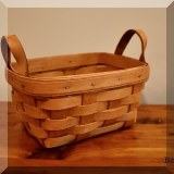 D75. Longaberger small basket with leather handles. - $12